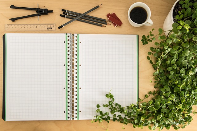 brass desk accessories with cream paper texture and warm wood surface